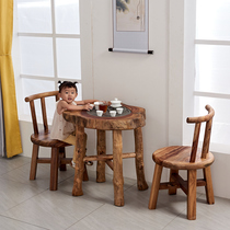 Round solid wood tea table and chair combination for balcony for tea house. Original ecological all solid wood camphor wood tea table for tea making.