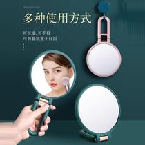 Double-sided small mirror can be folded and enlarged portable and multi-functional cosmetic mirror can be hung on the desktop and can stand in student dormitories.