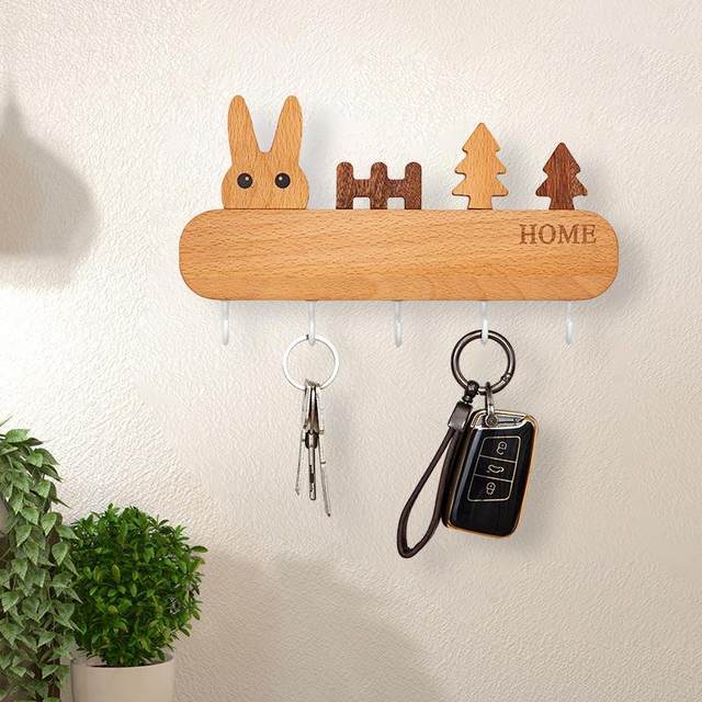 The key hook can enter the door. The key is closed. The wall decoration is hung on the wall key storage rack. The black solid wood loves the Nordic