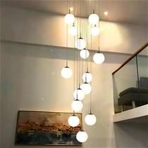 Miguang Huijias duplex loft apartment has a chandelier in Hall C of the Airbus a hollow Nordic staircase lamp a long simple and modern