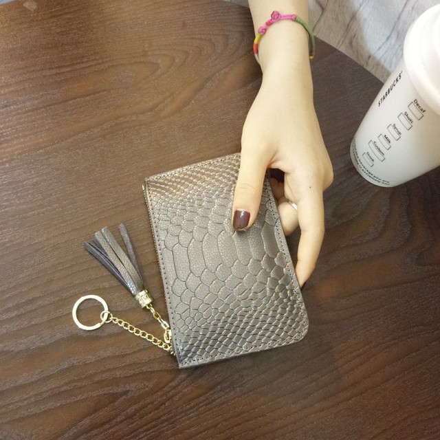 wallet ຫນັງແທ້ຂອງແມ່ຍິງ ultra-thin zipper mini 2024 ຮູບແບບໃຫມ່ຮ້ອນ cowhide coin purse ຂະຫນາດນ້ອຍອອກແບບ niche ອິນເຕີເນັດສະເຫຼີມສະຫຼອງ