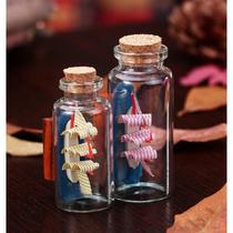 Bottled sailboat size drift bottle. Glass bottle gift with a sailboat inside a Mediterranean style decoration.