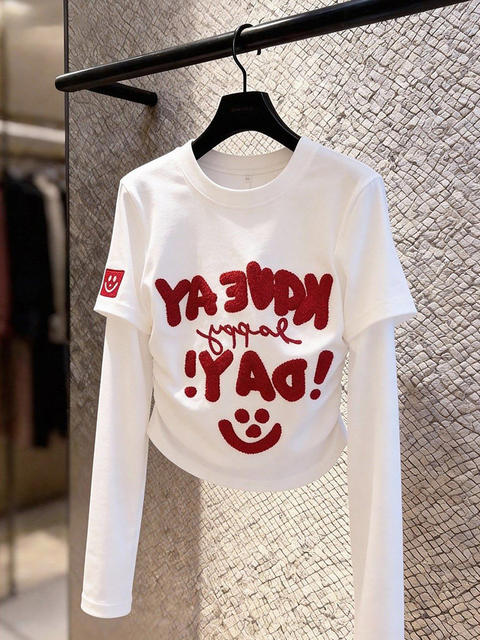 Niche non-contrasting white fake two-piece right shoulder long-sleeved T-shirt for women spring inner layering shirt design short top