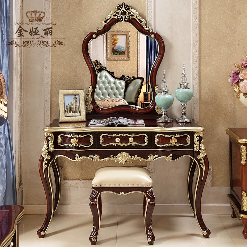 Bàn trang điểm phong cách châu âu đơn giản mini phòng ngủ chung cư nhỏ bàn trang điểm nướng sơn mục vụ tủ trang điểm lắp ráp công chúa sơn vàng - Bàn