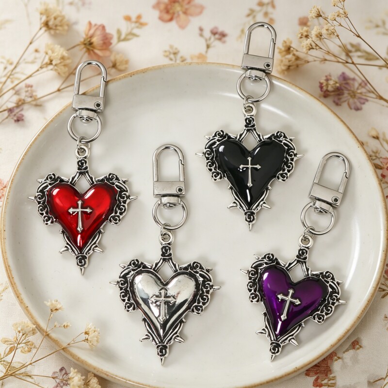 Instagram-worthy heart-shaped cross keychain, a unique and niche metal pendant, handmade bag charm, gift accessory.
