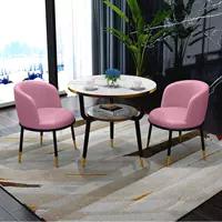 Розовый один стол и два стула