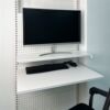 Perforated board bookshelf floating tabletop