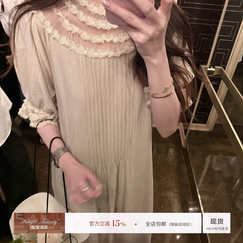 For Jie Shijie, the "Tea Break Girl, a Loose Long Dress for Women with Tencel Fabric, Vintage French Lace Splicing, and Accordion Pleats