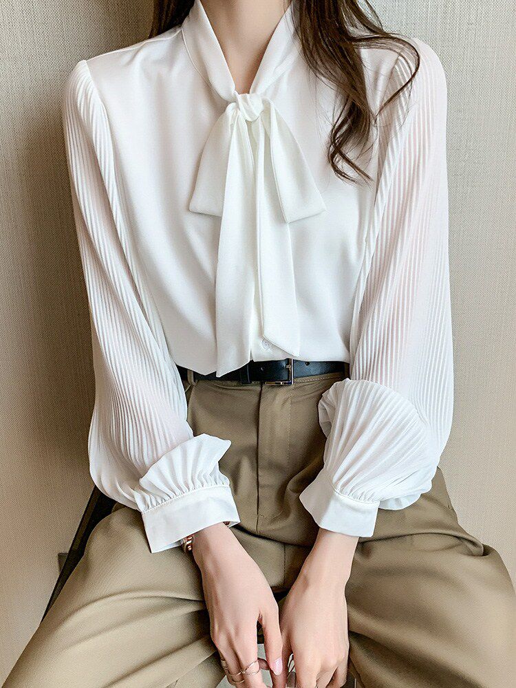 Tidal Bow Bow Tie White Shirt Woman 2022 Chunqiu New women's clothing floating with long sleeves loose and snow-spinning blouses