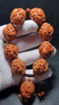 Olive stone God of Wealth Bracelet Eight God of Wealth core glyph play bracelet retro ethnic style pure handmade iron core animal year