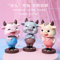 Cartoon shaking head Niu Niu car ornaments car cute car decoration personality creative car doll Net Red Bull