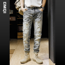 Spring American retro-heavy process washed edge with cloth breaking hole denim jeans male elastic body straight cylinder pants tide