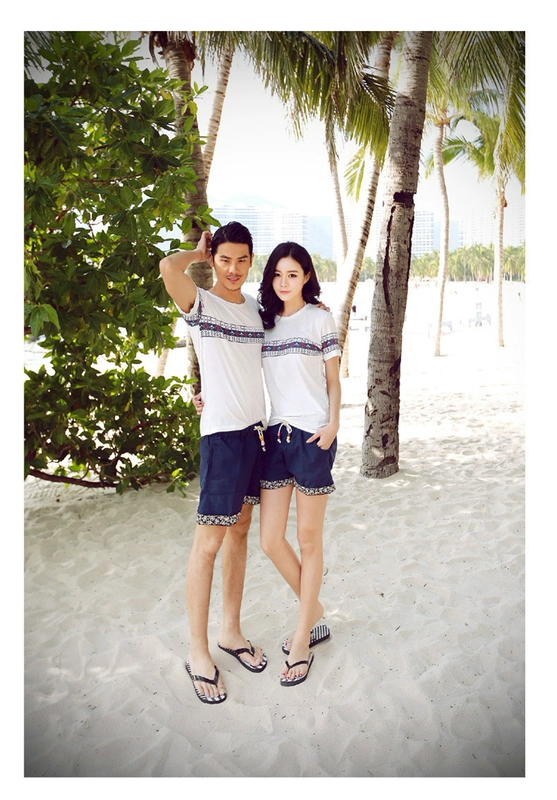 Quần short nam mùa hè cotton và vải lanh lỏng thường mặc năm quần xu hướng quần lớn thẳng Kỳ nghỉ bên bờ biển đôi quần đi biển - Quần bãi biển quần đi biển sắc màu