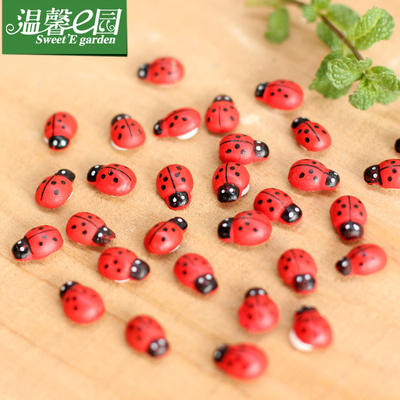 Micro-landscape ornaments: Wooden beetles and seven-spotted ladybugs