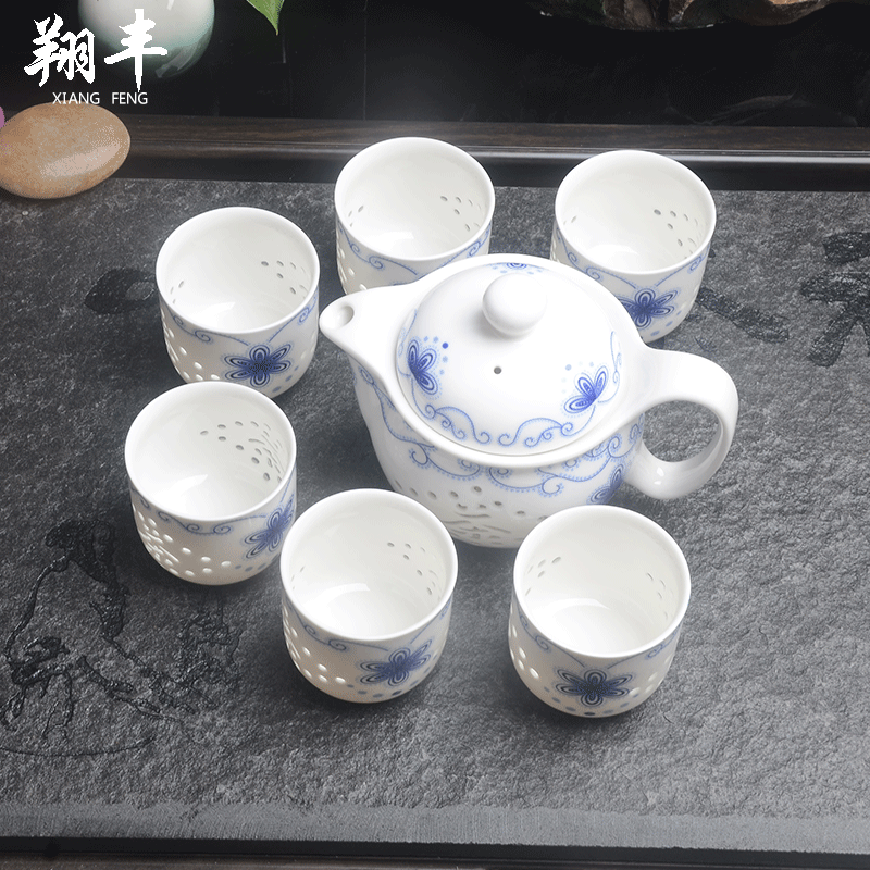 Xiang feng and exquisite tea sets suit of blue and white porcelain honeycomb hollow ceramic kung fu tea teapot teacup tea sea capacity