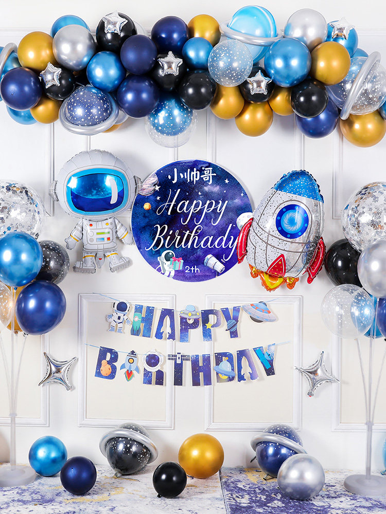 The boy's birthday space-themed balloon decorates the background wall with a child's child scene decoration