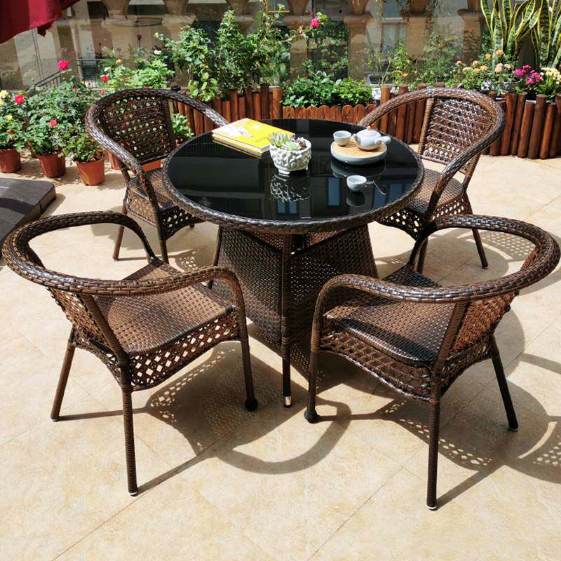 Simple balcony table and chairs Three-five-piece suit Outdoor Casual Outdoor Round Table Small Teng Chair Tea Table Combination Lean Back Chair
