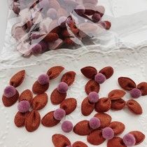 3214 A pack of about 60 brown fur ball bows