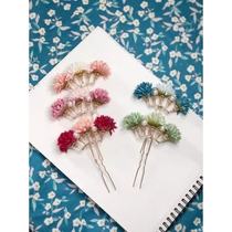 A pair of silk flowers and pearls long rows of hairpins