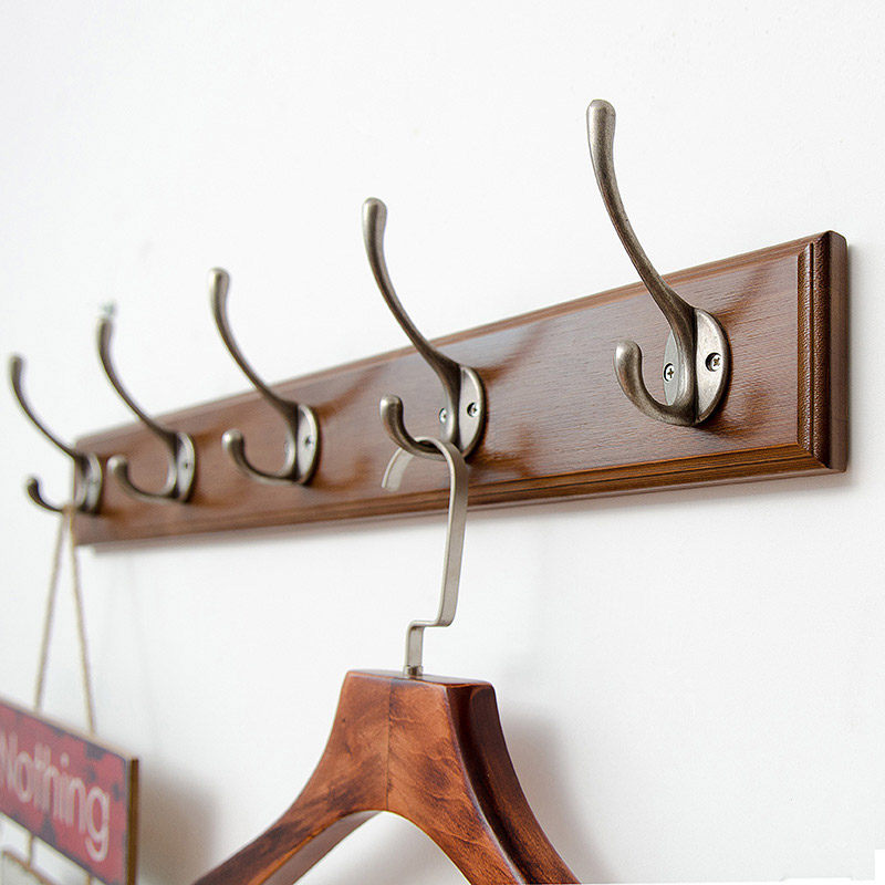 Women's clothing store clothes hook hooks a row of coat hooks long wooden hooks wall hanging door wall hanger hanging clothes hook