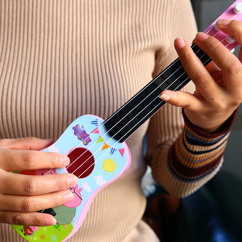 Đồ chơi trẻ em quà tặng mô phỏng phim hoạt hình mini ukulele trẻ em guitar nhỏ giáo dục sớm nhạc cụ đồ chơi - Đồ chơi âm nhạc / nhạc cụ Chirldren