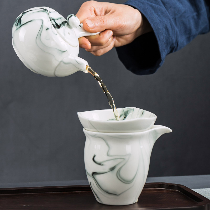 Building In hand - made kung fu tea set household contracted blue and white porcelain ceramic dehua white porcelain tea set. A complete set of tea cups