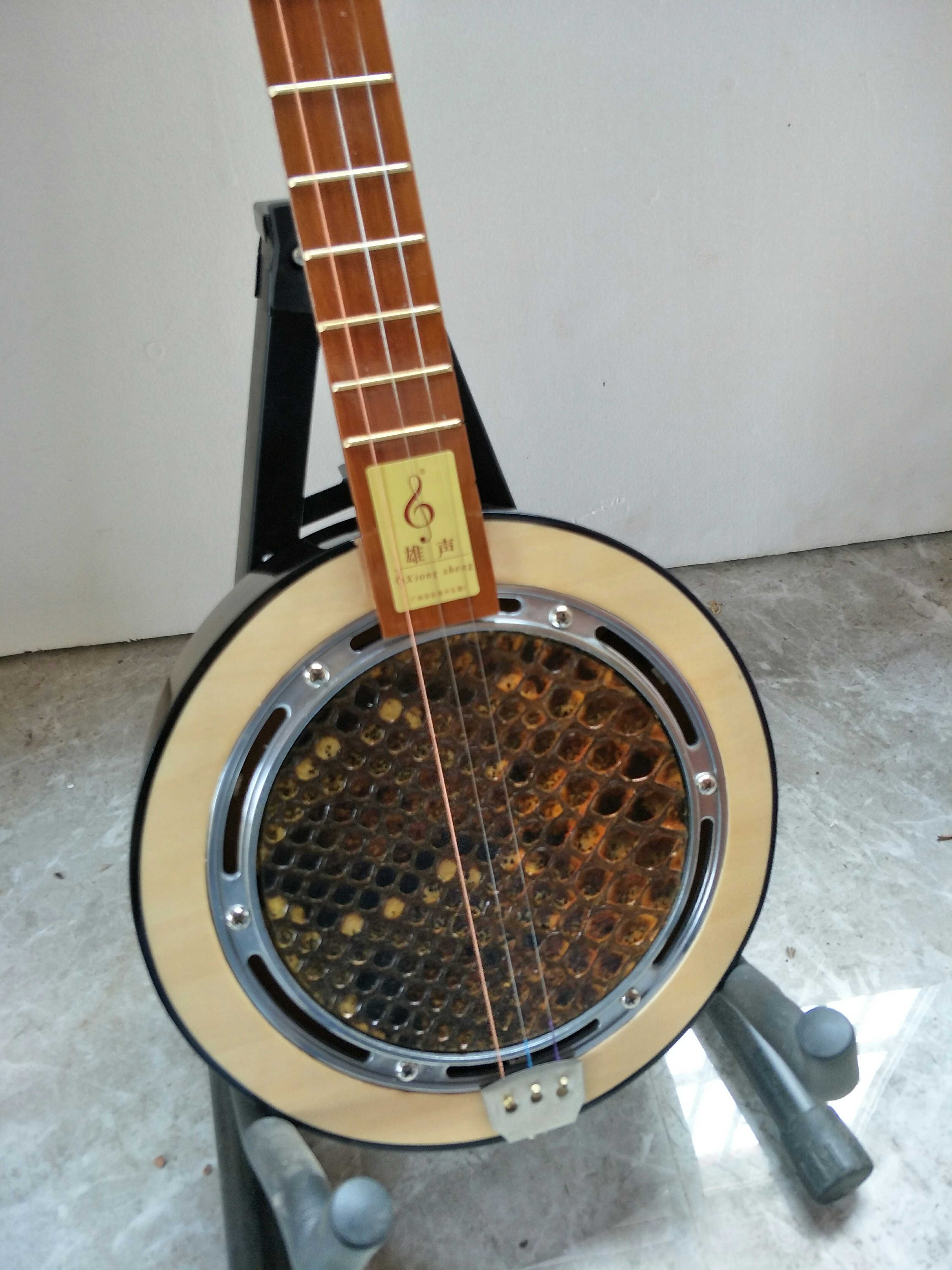 Xiongsheng manufacturers direct sales three-string python snake skin garden shape Qinqin Cultural Revolution ancient musical instruments manufacturers direct sales