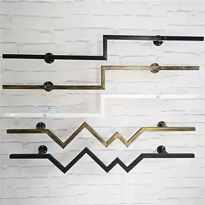 Clothing display on the wall is Pendant men's and women's children's clothing store hangers vintage wall the bending shelf