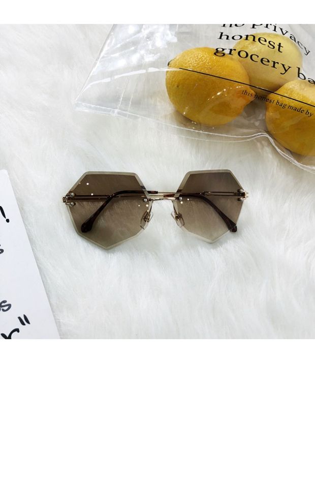 Châu Âu và Hoa Kỳ đa giác không khung cắt tỉa kính râm nữ gradient đại dương màu sắc kính râm chống UV nữ kính không độ