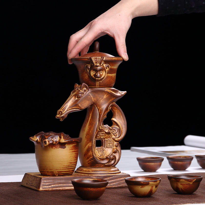 Xin art ceramic semi - automatic edge tea set creative hot tea. Preventer character coarse pottery of a complete set of kung fu tea set