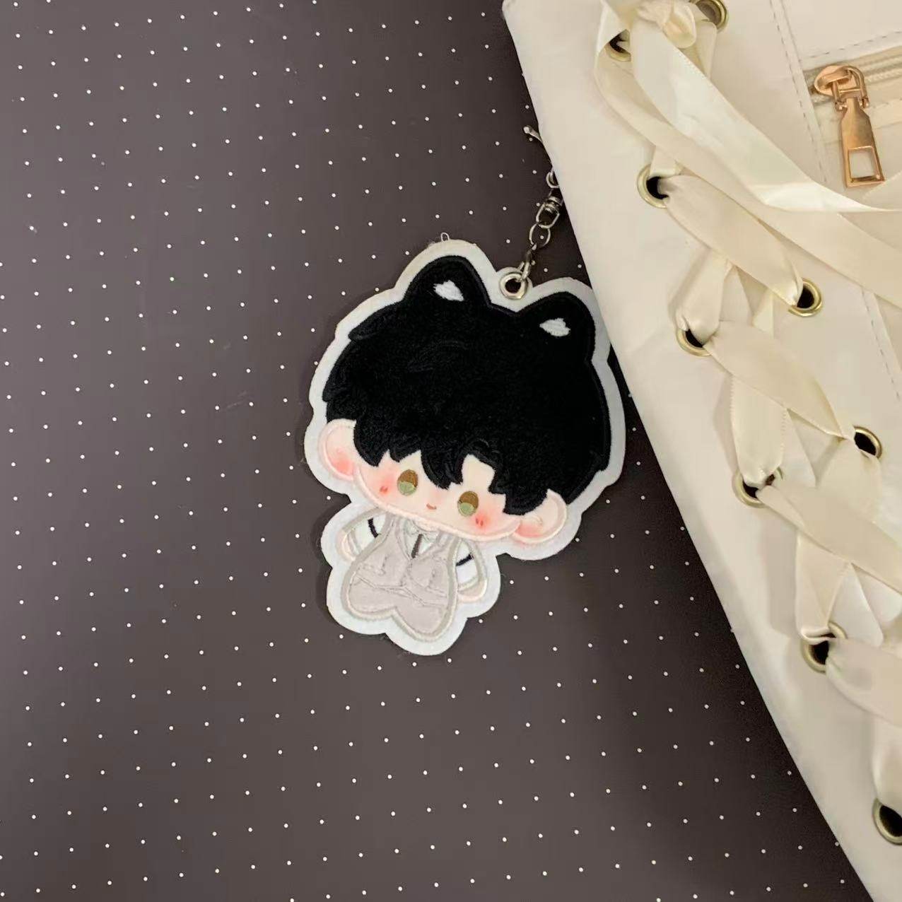 Fan-made Zayne embroidered plush charm attached to a bag