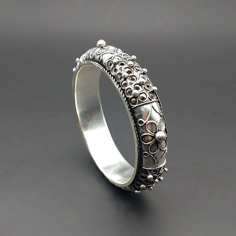 Ethnic minority wind Guizhou Miao personality jewelry pure hand-made traditional exaggerated hollow rivet Miao silver bracelet