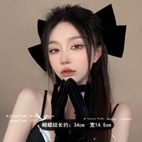 Большая черная заколка для волос с бантиком