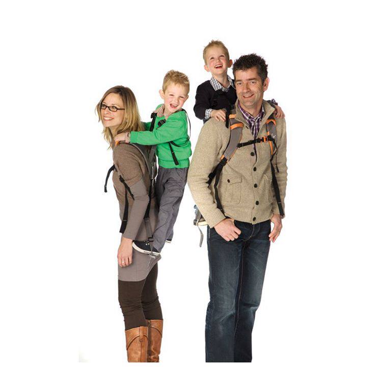 Piggyback Rider children stand upright and hold baby bag