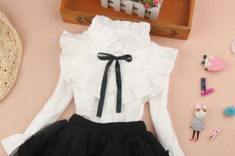 Mùa thu đông 2018 cho bé gái áo trắng tay dài cotton cộng với cổ áo nhung nơ dày áo ấm shop bán đồ trẻ em