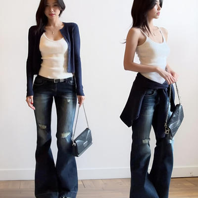 A Korean-style navy blue button-down cardigan knitted sweater for women's spring and autumn short style. Pair it with a layering halter top and a versatile two-piece set