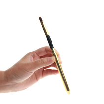 Upscale gold with a lid on the lip brush.