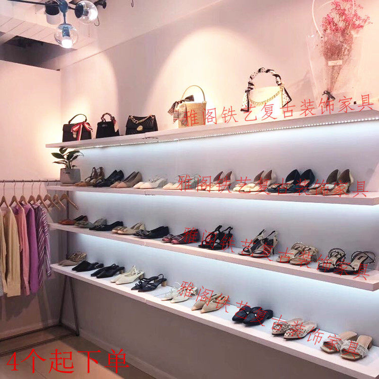 Shoe store shoe rack display shelf children's shoe store open shop with clothing store shoe cabinet shop with bag on the wall hanging shoe wall