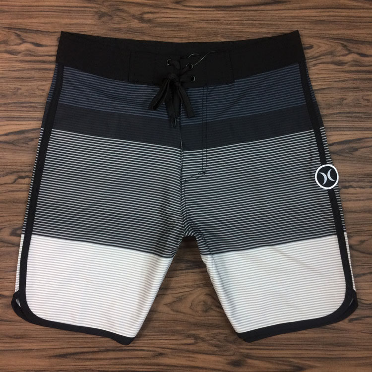 Men's fitness competition quick-drying beach pants loose middle pants black and white striped casual pants summer large size five-point swimming trunks