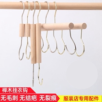 A row of long rows of clothes hooks behind the shower curtain door clothes hooks solid wood hook hangers multi-function seamless hook clothes hook