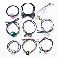 Набор из 9 предметов темно-синего цвета, диаметр примерно 4,5 см.