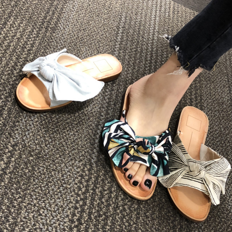 Korean fashion sandals and slippers wear female bow slippers net red drag beach flat shoes