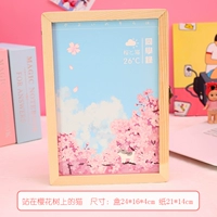 Кошка стоит на вишне