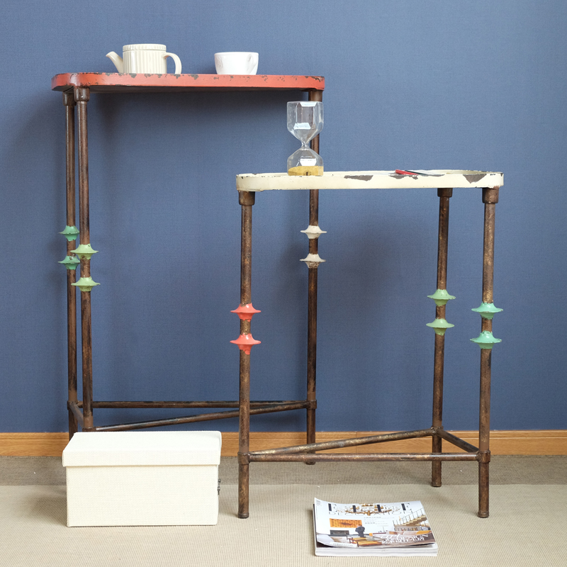 American country retro wrought iron tripod small side table sofa corners a few phones a few floor ornaments racks