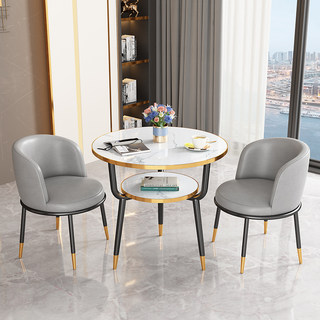 Small round table and chairs for reception and negotiation on balcony of small apartment