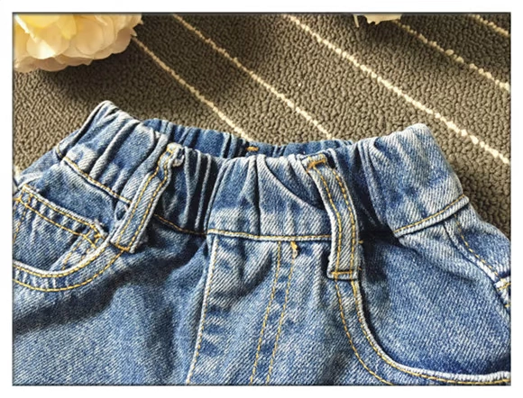 Phong cách mùa hè mới của trẻ em năm 2020 quần short denim trẻ em lớn cho bé trai và bé gái Phiên bản Hàn Quốc của quần dài đi biển bằng vải bông tinh khiết xé quần nóng - Quần