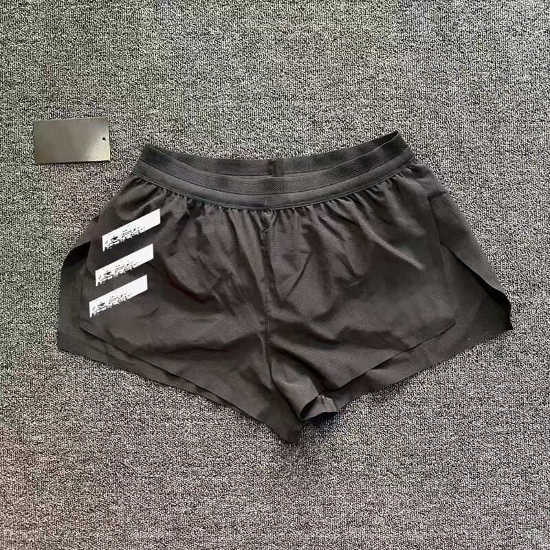 New Style Fake Two-Piece Seamless Quick-Drying Elastic Three-Quarter Pants for Men and Women, Zero-Resistance Marathon Fitness Training Ultra-Short Pants New Style Fake Two-Piece Seamless Quick-Drying Elastic Three-Quarter Pants for Men and Women, Zero-Resistance Marathon Fitness Training Ultra-Short Pants