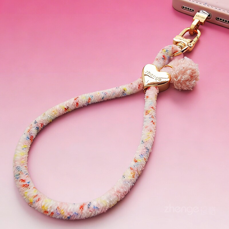 Short, stylish leopard print heart plush wristband for mobile phones, fashionable and unique, suitable for outdoor travel, portable and sturdy.
