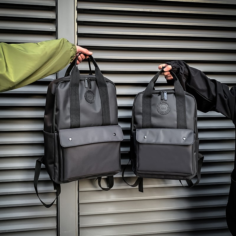 Backed men and shoulder bags girl 2022 new fashion Han Edition middle school bag computer label Oxford texture