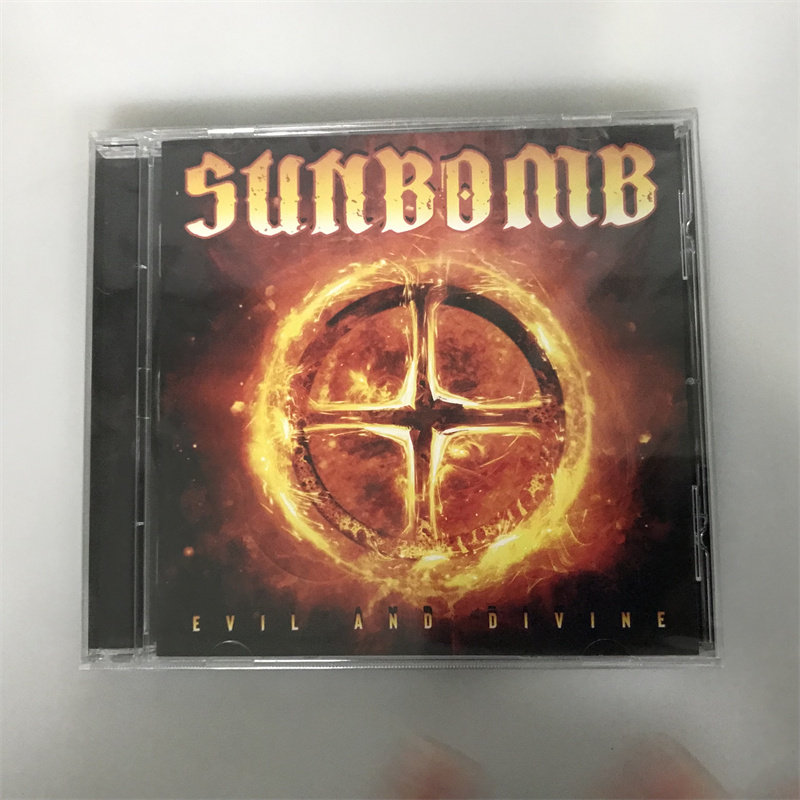 Версия OM на нераспечатанном компактдиске Rock Sunbomb Evil и Divine Изображение 1